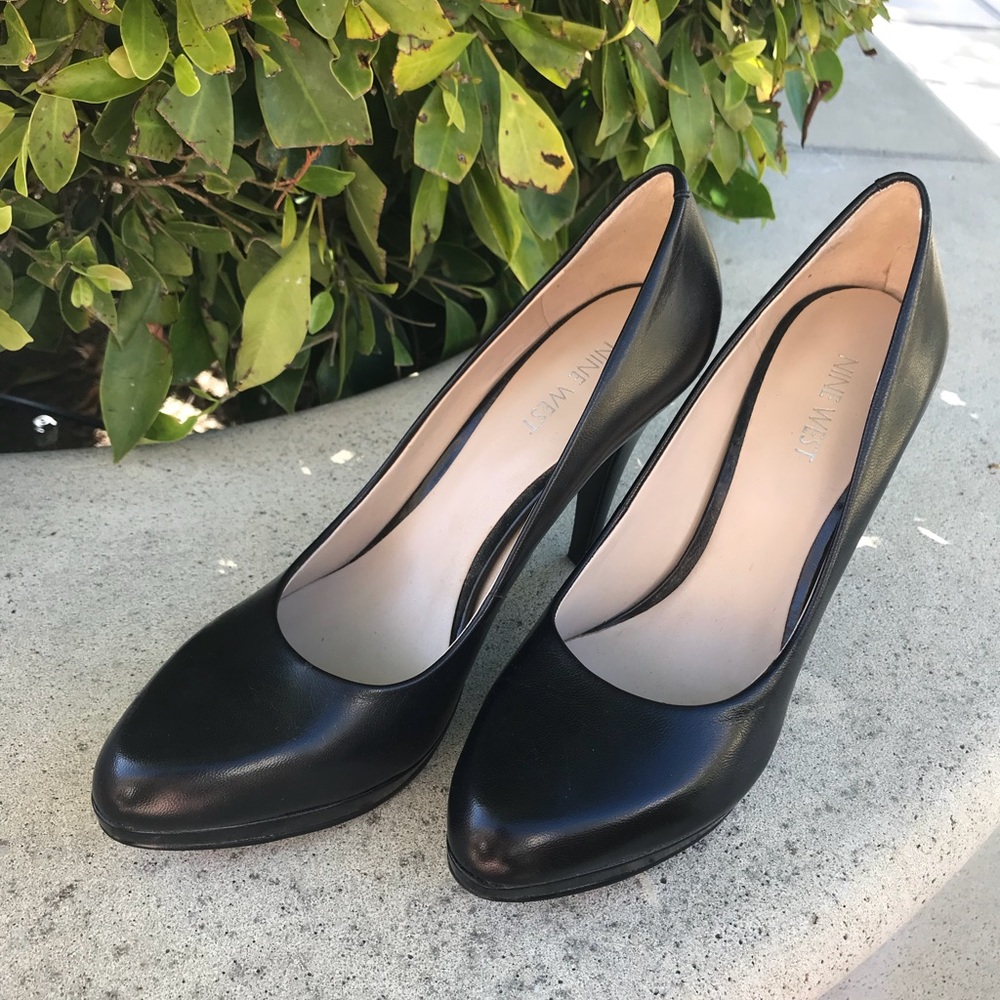 Black leather pumps